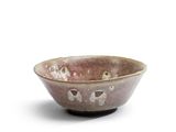 a close up of a small bowl on a white surface