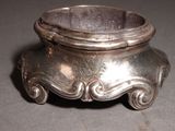 a silver bowl sitting on top of a table