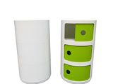 two white and green drawers are next to each other on a white surface
