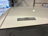 a sticker on the hood of a car in a garage