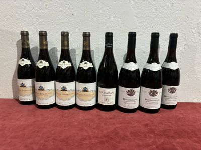 six bottles of wine are lined up on a table