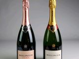 two bottles of champagne sitting next to each other on a table