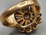 an image of a gold ring with gears inside of it