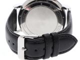 black leather strap on a watch with a white face
