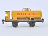 a toy train car with a yellow tank on it