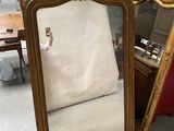 two mirrors sitting next to each other on the floor