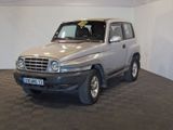 a silver car that is parked in a room