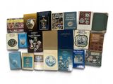 a lot of books that are sitting on a table