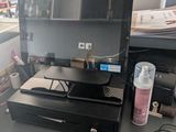 a laptop computer sitting on top of a desk with a mouse