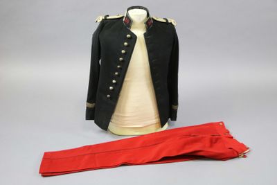 an image of a black jacket and red pants on a mannequin
