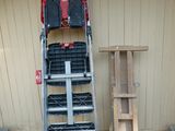 a picture of a ladder with a tool box on top of it