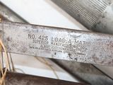 a close up of a metal object with a tag on it