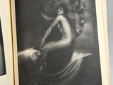an open book with a black and white photo of a woman
