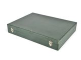 green leatherette suitcase with metal handles on a white background