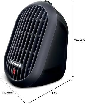 un radiateur noir posé sur une surface blanche