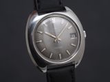 a close up of a wrist watch on a black background
