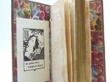 an open book with a picture of a cat inside of it