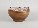 an image of a wooden bowl with a white substance inside of it