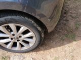 a car that has a tire on the side of the road