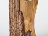 a wooden candle holder with a tree stump design on it