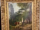 a picture of a painting on a easel with a painting of sheep in the background