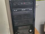 a desktop computer sitting on top of a wooden table
