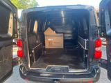 a black van with a box in the back of it