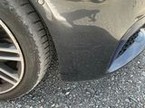 a close up of a car ' s tire on the road