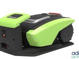 a close up of a green and black machine on a white background