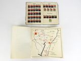 two pages of a book with a map and a picture of soldiers in uniform