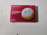 the box of golf balls is on the table ready to be put in
