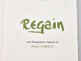 a white book with green writing on it