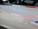 a car door handle with a sticker on it