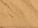 a piece of brown paper with a stamp on it