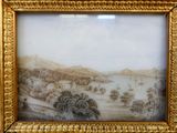 l'image d'un tableau représentant un paysage, dans un cadre doré