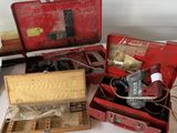 a lot of tools in a red case on a table