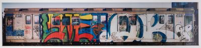 a picture of a train with graffiti on the side of it