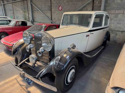 several old cars are parked in a garage next to each other