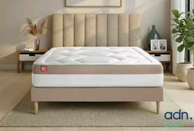 a bed that has a mattress on it in a room