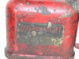 an old red fire hydrant with a sign on it