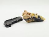 a close up of a piece of food on a white surface