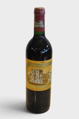 a bottle of wine that is sitting on a table