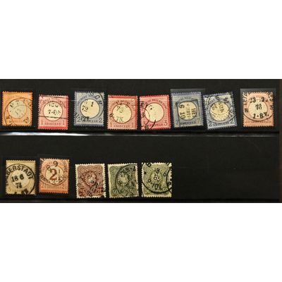 a group of stamps from different countries on a black surface