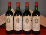 three bottles of wine sitting on top of a table next to a wooden box