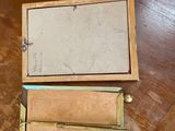 a small wooden box sitting on a table on the floor