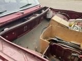 a box of junk in the back of a pickup truck