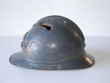 a metal helmet with a hole in the middle of it