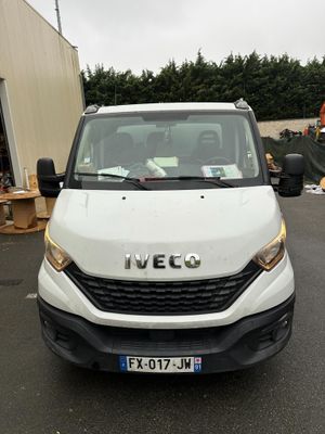 a white van that is parked in a parking lot