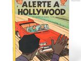 un livre sur lequel figure le dessin d'un homme au volant d'une voiture rouge