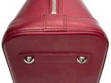 the red leather case is open and ready to be used